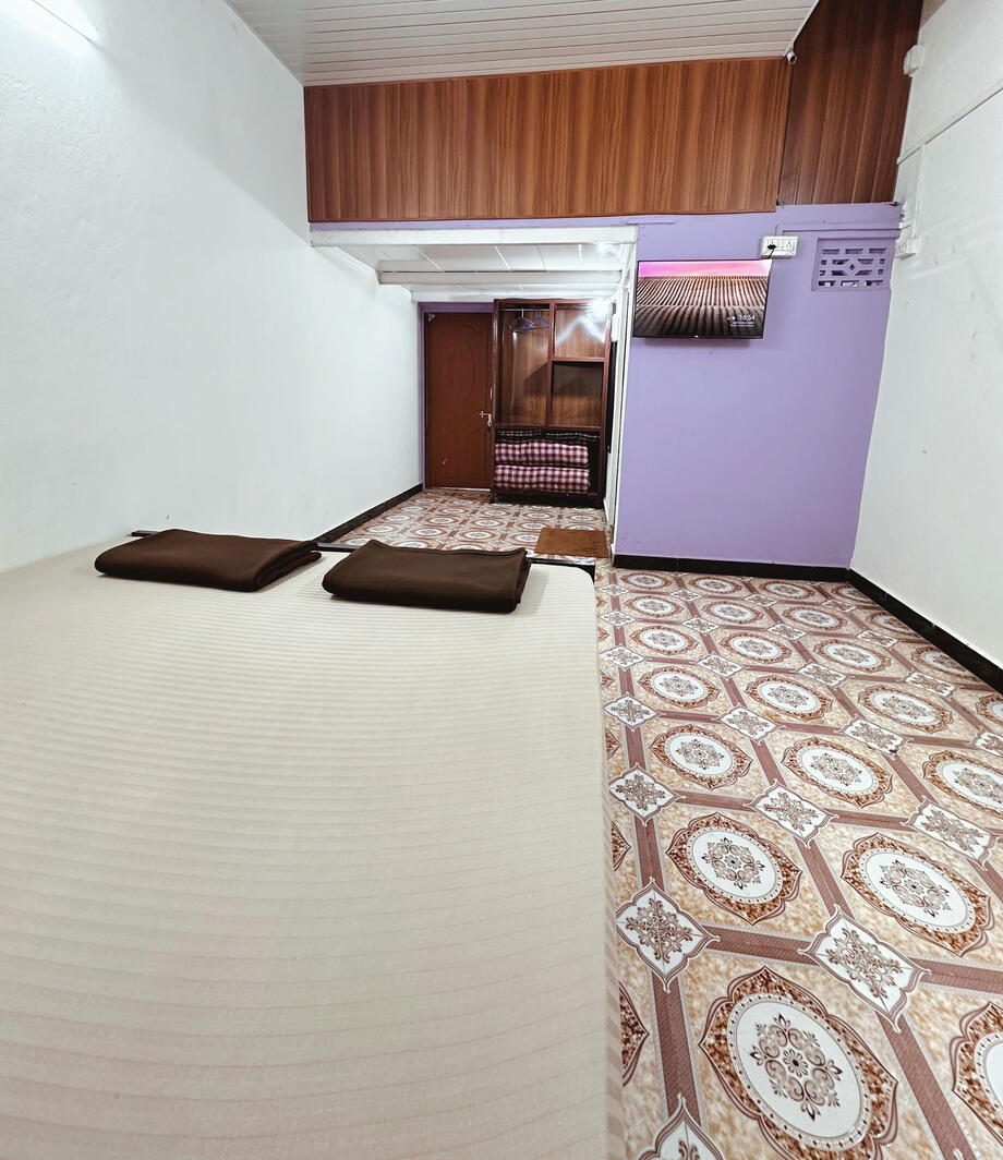 Exterior view of Konkan Central Homestay building on Mumbai Goa highway.